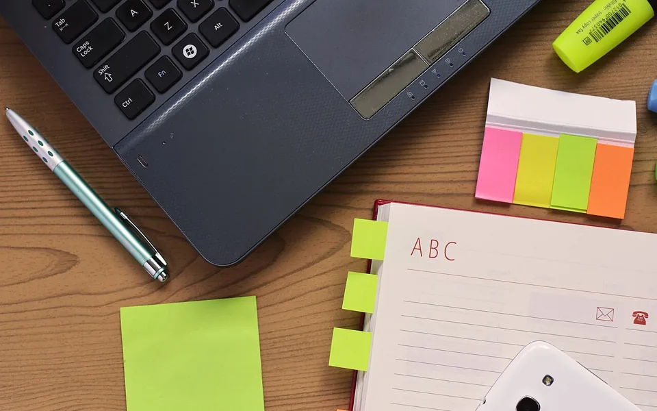 Notebook and writing materials on a desk